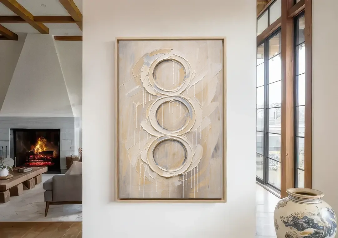 White Abstract Wall Art with Three Stacked Rings canvas wall art in a living room with a fireplace