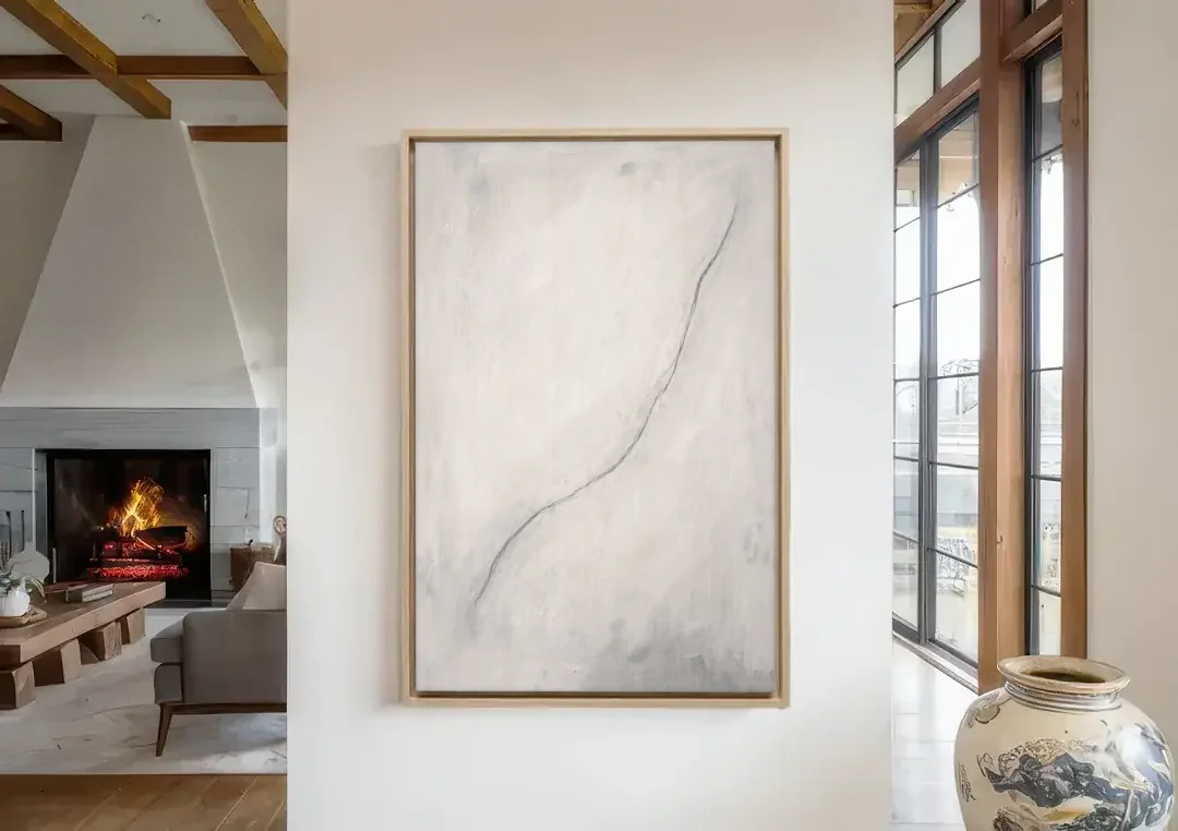 White Minimalist Wall Art with a Falling Charcoal Thread canvas wall art in a living room with a fireplace