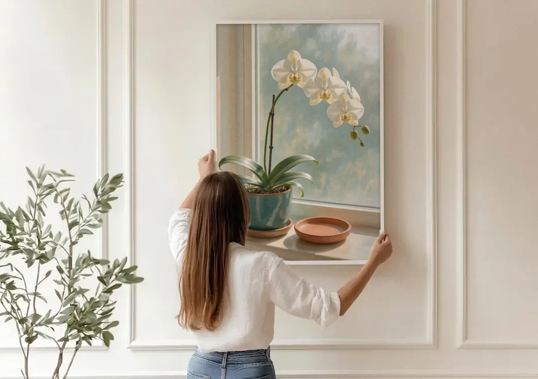 White Orchid on a Sunlit Sill for the Bathroom canvas wall art being hung on a paneled wall