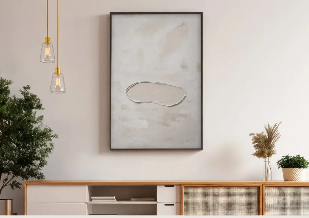 White Plaster Stone Outline on Ivory canvas wall art above a wooden sideboard under pendant lights
