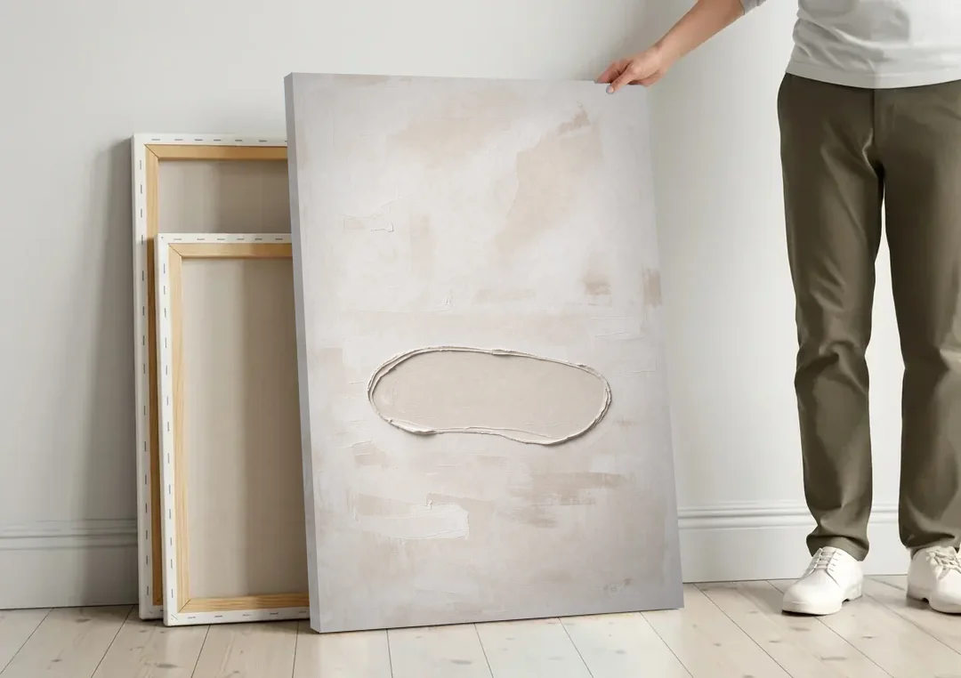 White Plaster Stone Outline on Ivory canvas wall art leaning against a wall next to blank canvases