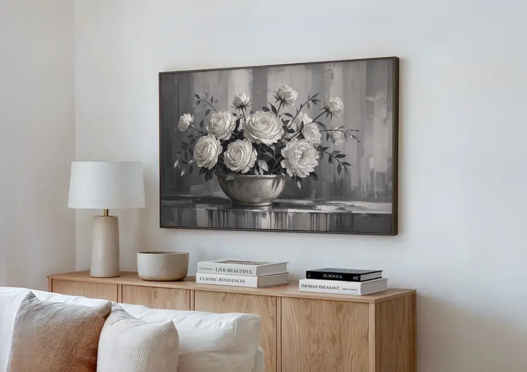 White Roses and Peonies in a Stoneware Bowl canvas wall art above a wooden sideboard next to a sofa