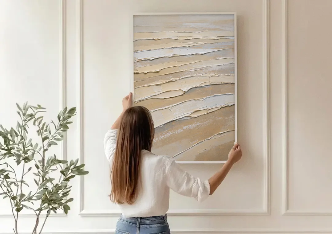 White Textured Painting of Low Tide Ridges canvas wall art being hung on a paneled wall