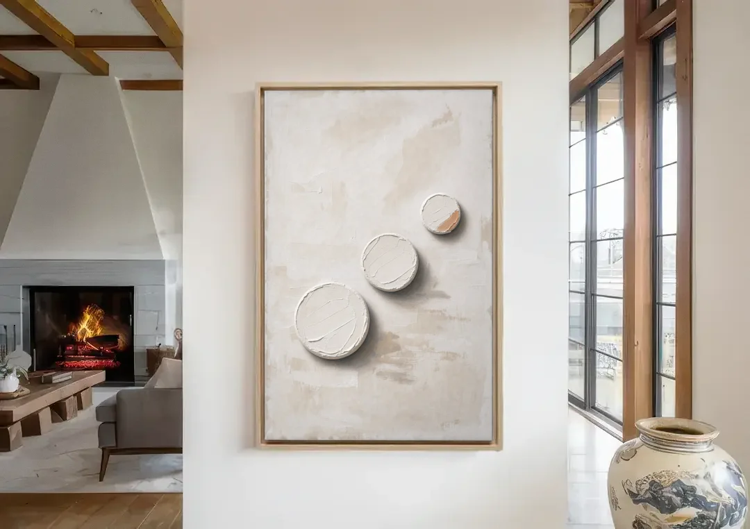 White Textured Wall Art of Three Rising Discs canvas wall art in a living room with a fireplace
