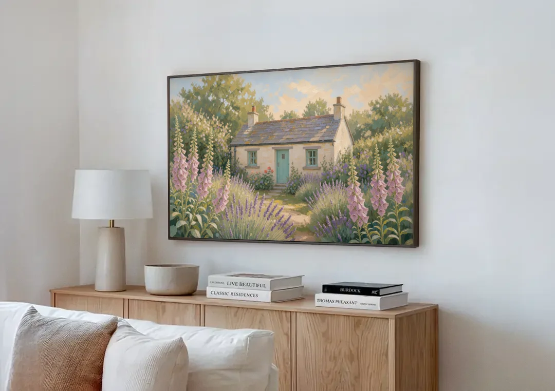 Whitewashed Cottage in Foxgloves and Lavender canvas wall art above a wooden sideboard next to a sofa