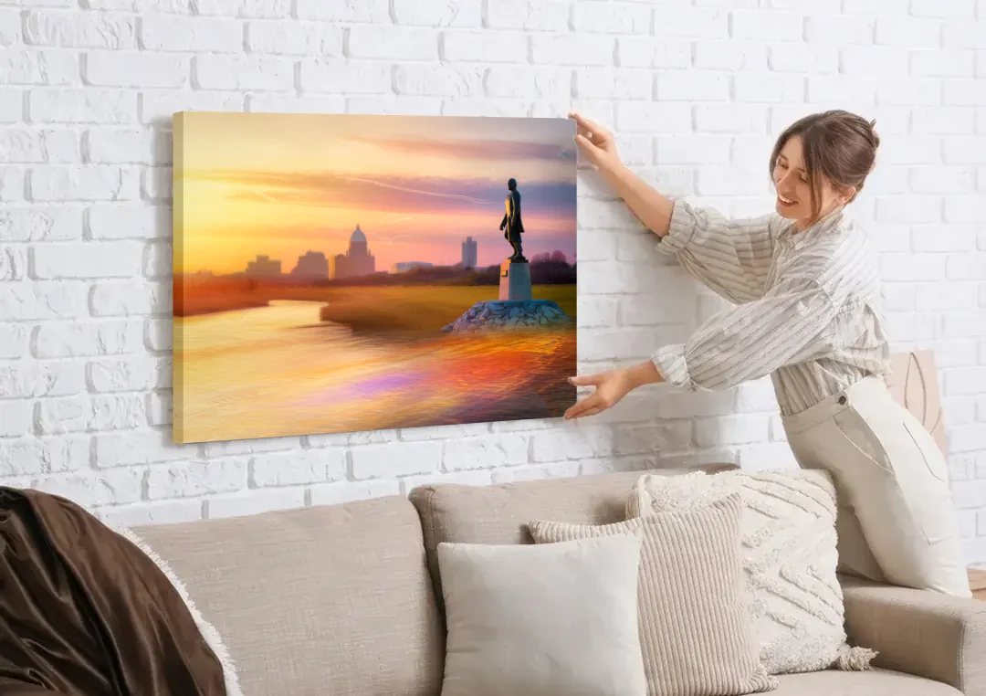 Wichita Skyline Sunset canvas wall art being hung on a white brick wall above a sofa