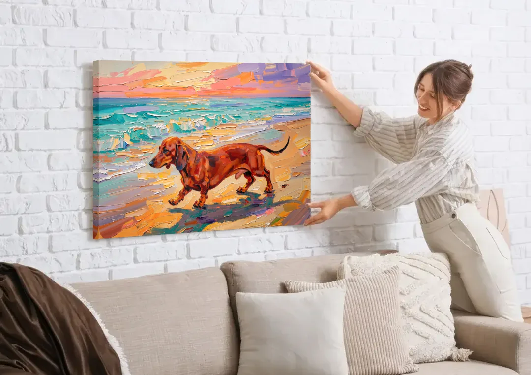 Wiener Dog Painting Sunset Beach Trot canvas wall art being hung on a white brick wall above a sofa