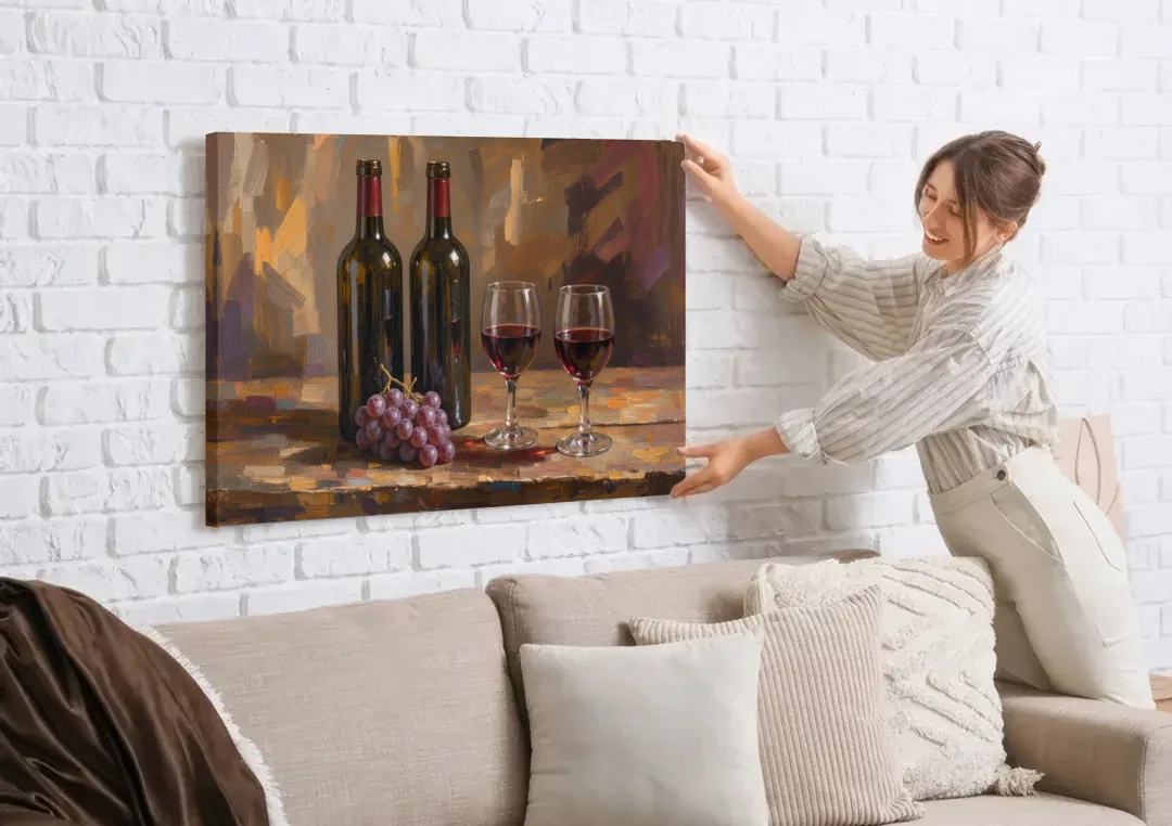 Wine Decor Wall Art with Two Bottles and Grapes canvas wall art being hung on a white brick wall above a sofa