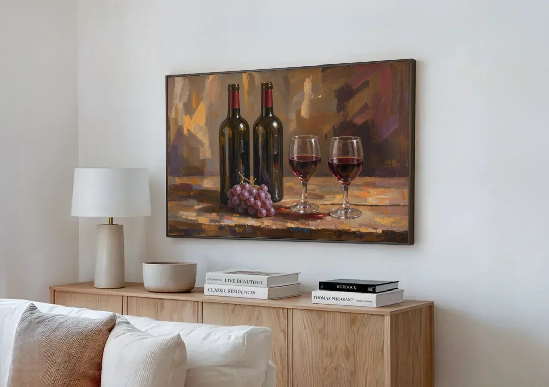 Wine Decor Wall Art with Two Bottles and Grapes canvas wall art above a wooden sideboard next to a sofa