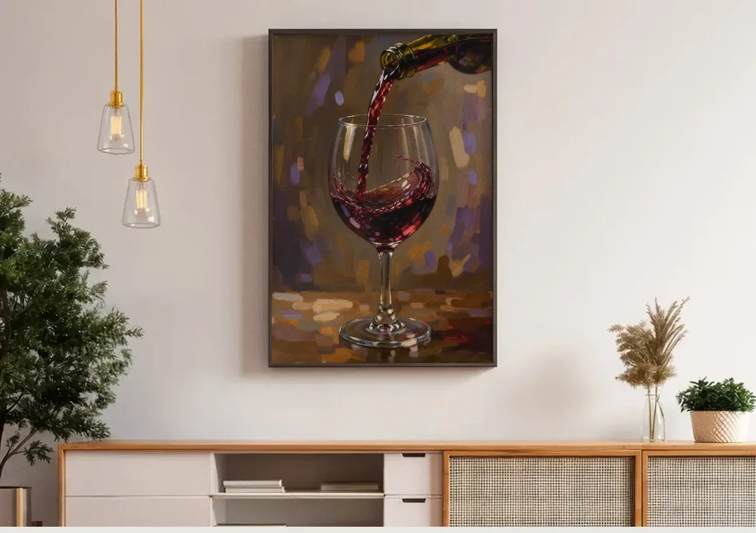 Wine Glass Wall Art with a Swirling Red Pour canvas wall art above a wooden sideboard under pendant lights