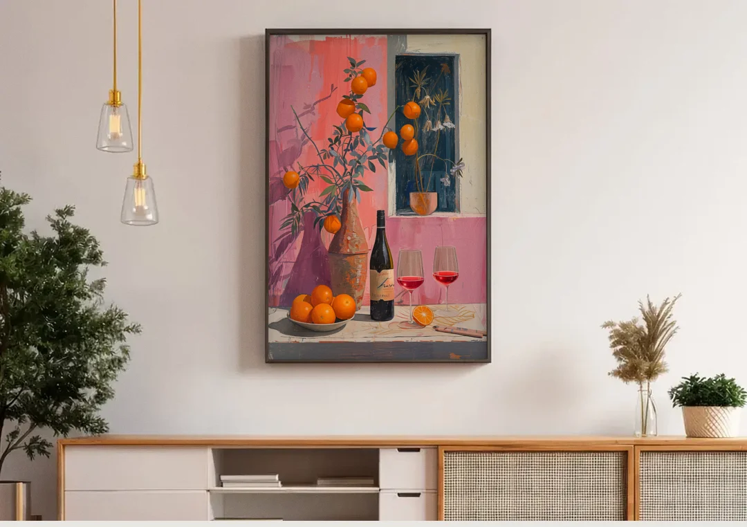 Wine Painting with Oranges on Pink canvas wall art above a wooden sideboard under pendant lights