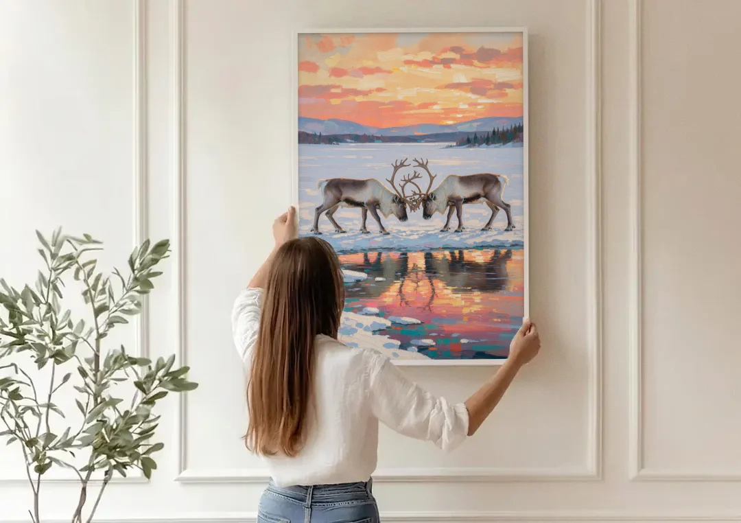 Winter Animal Painting of Sparring Reindeer canvas wall art being hung on a paneled wall
