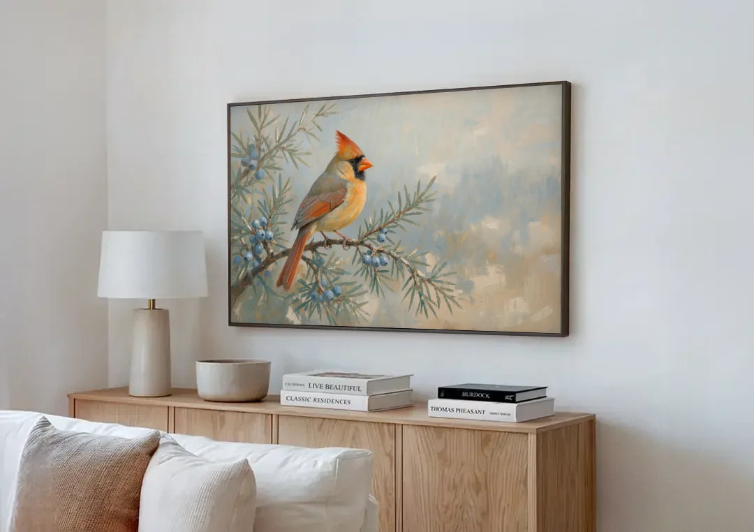 Winter Bird Painting with Juniper Berries canvas wall art above a wooden sideboard next to a sofa