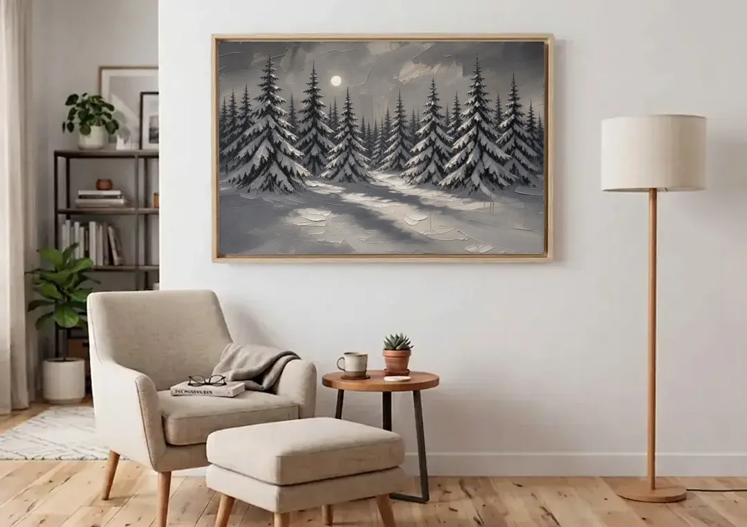 Winter Forest Painting Under a Full Moon canvas wall art above an armchair in a bright living room
