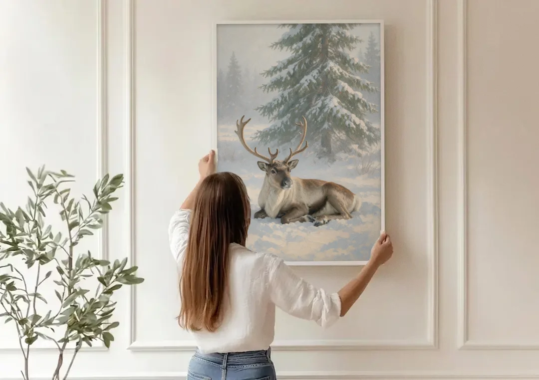 Winter Reindeer Resting Under the Spruce for the Living Room canvas wall art being hung on a paneled wall