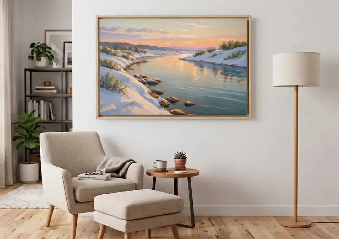 Winter River Painting at Dusk canvas wall art above an armchair in a bright living room