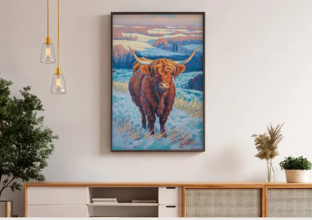 Winter Wonderland Highland Cow canvas wall art above a wooden sideboard under pendant lights