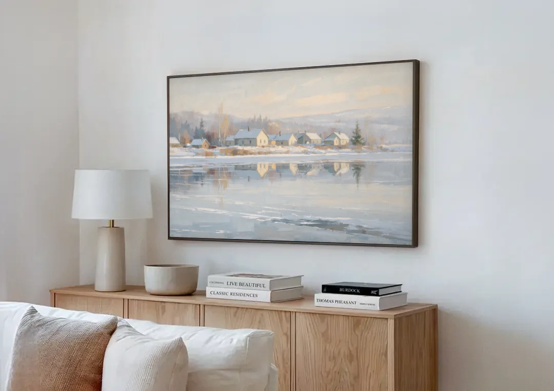 Winter Wonderland Wall Art by the Frozen Lake canvas wall art above a wooden sideboard next to a sofa