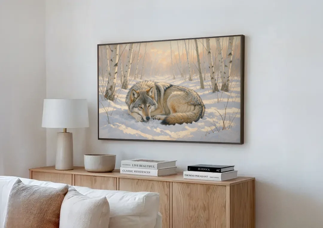 Wolf in Snow Painting Among the Birches canvas wall art above a wooden sideboard next to a sofa