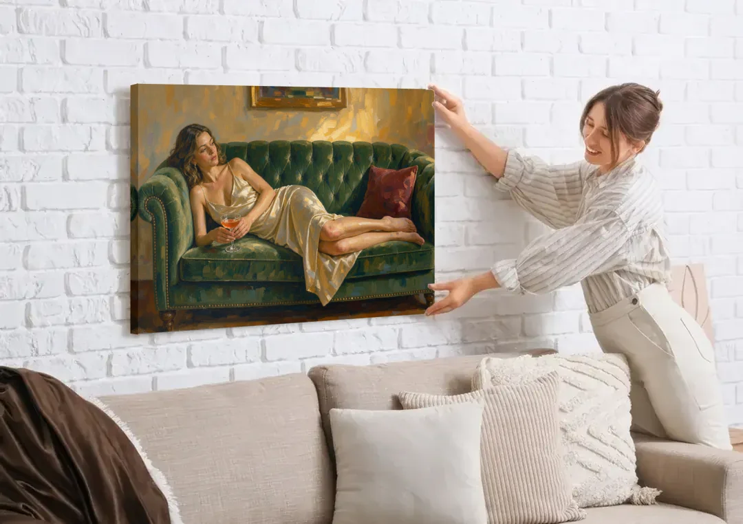 Woman on Sofa Painting with a Blush Coupe canvas wall art being hung on a white brick wall above a sofa