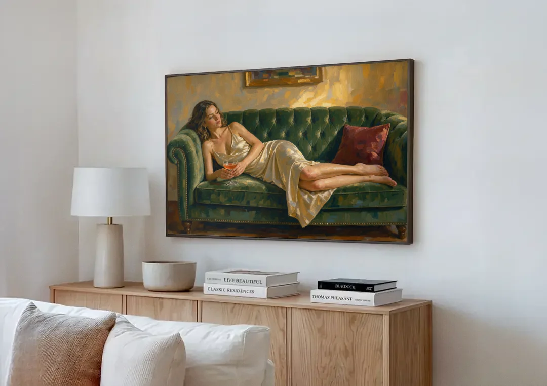Woman on Sofa Painting with a Blush Coupe canvas wall art above a wooden sideboard next to a sofa