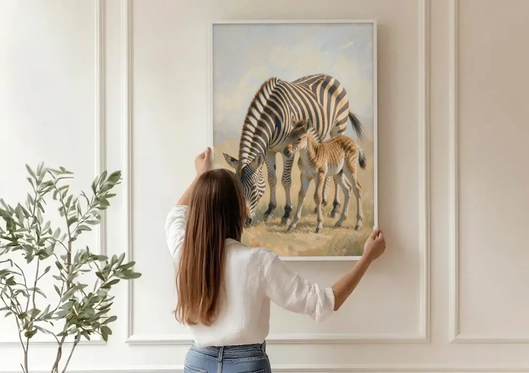 Zebra Mare Nuzzling Her Foal for the Bathroom canvas wall art being hung on a paneled wall