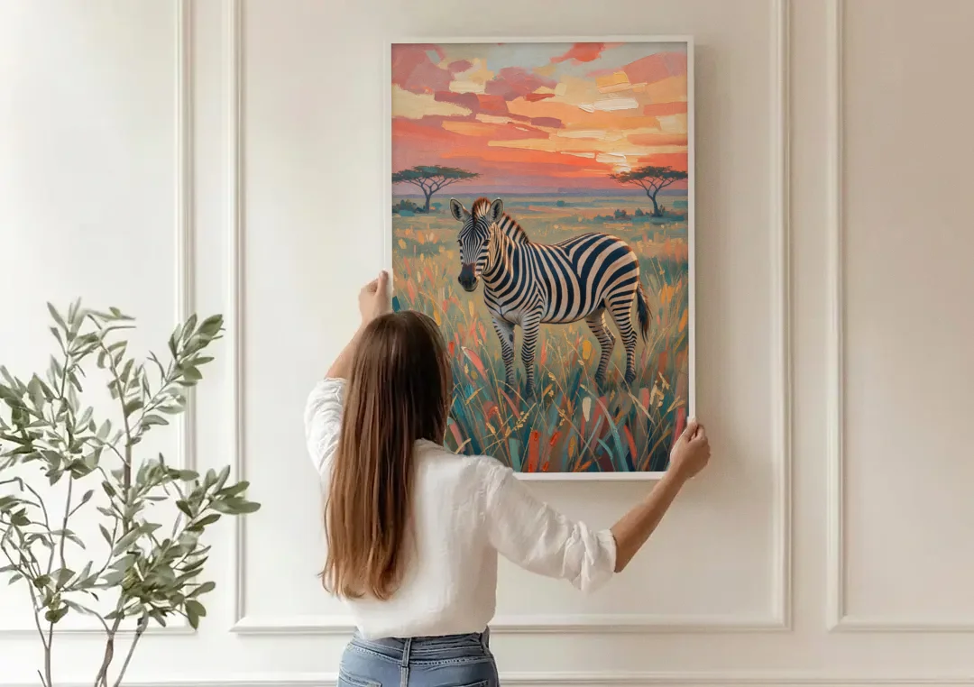 Zebra Oil Painting in Sunset Grass canvas wall art being hung on a paneled wall