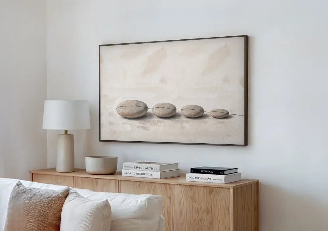 Zen Stones Painting on a Fine Thread canvas wall art above a wooden sideboard next to a sofa
