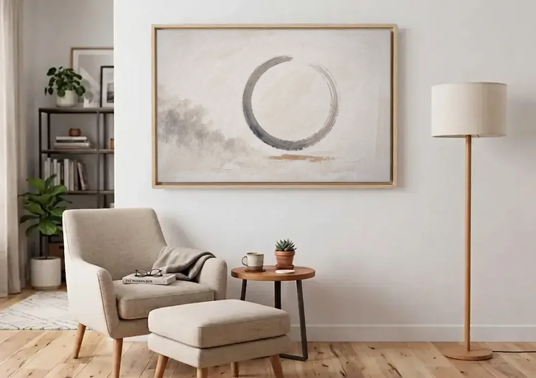 Zen Wall Art Open Ink Circle with Cedar Smudge canvas wall art above an armchair in a bright living room