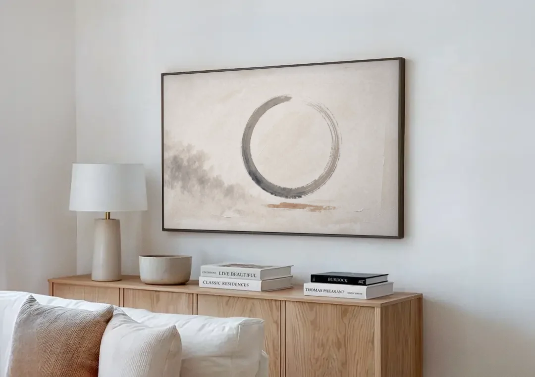Zen Wall Art Open Ink Circle with Cedar Smudge canvas wall art above a wooden sideboard next to a sofa